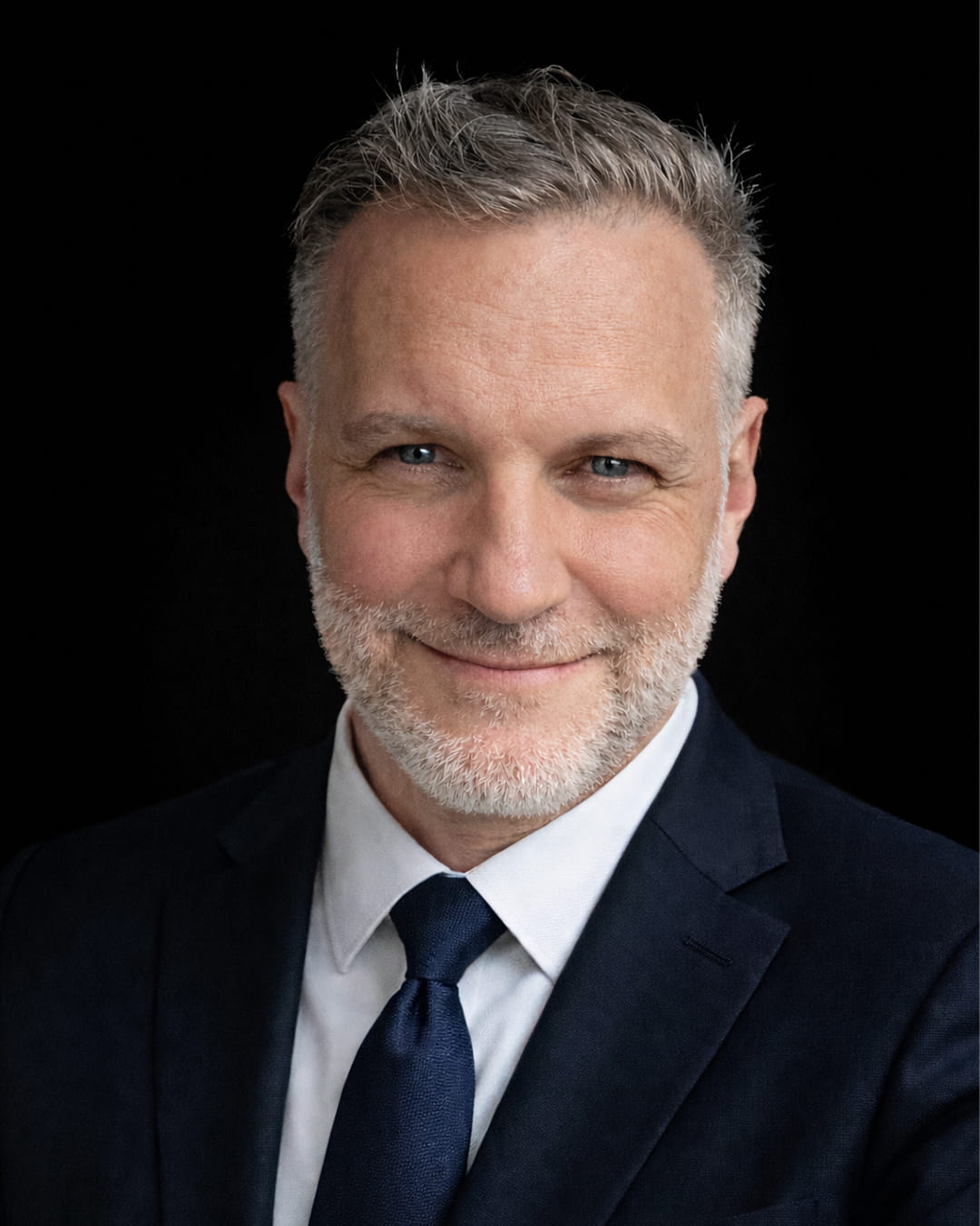A professional photo of Dr. Reinhard Winkler